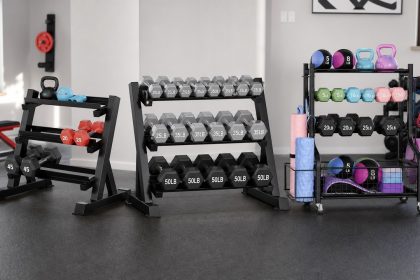 Dumbbell rack with neatly organized hex dumbbells in a compact home gym