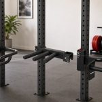 Power rack dip attachments mounted on steel uprights for a home gym compatibility comparison