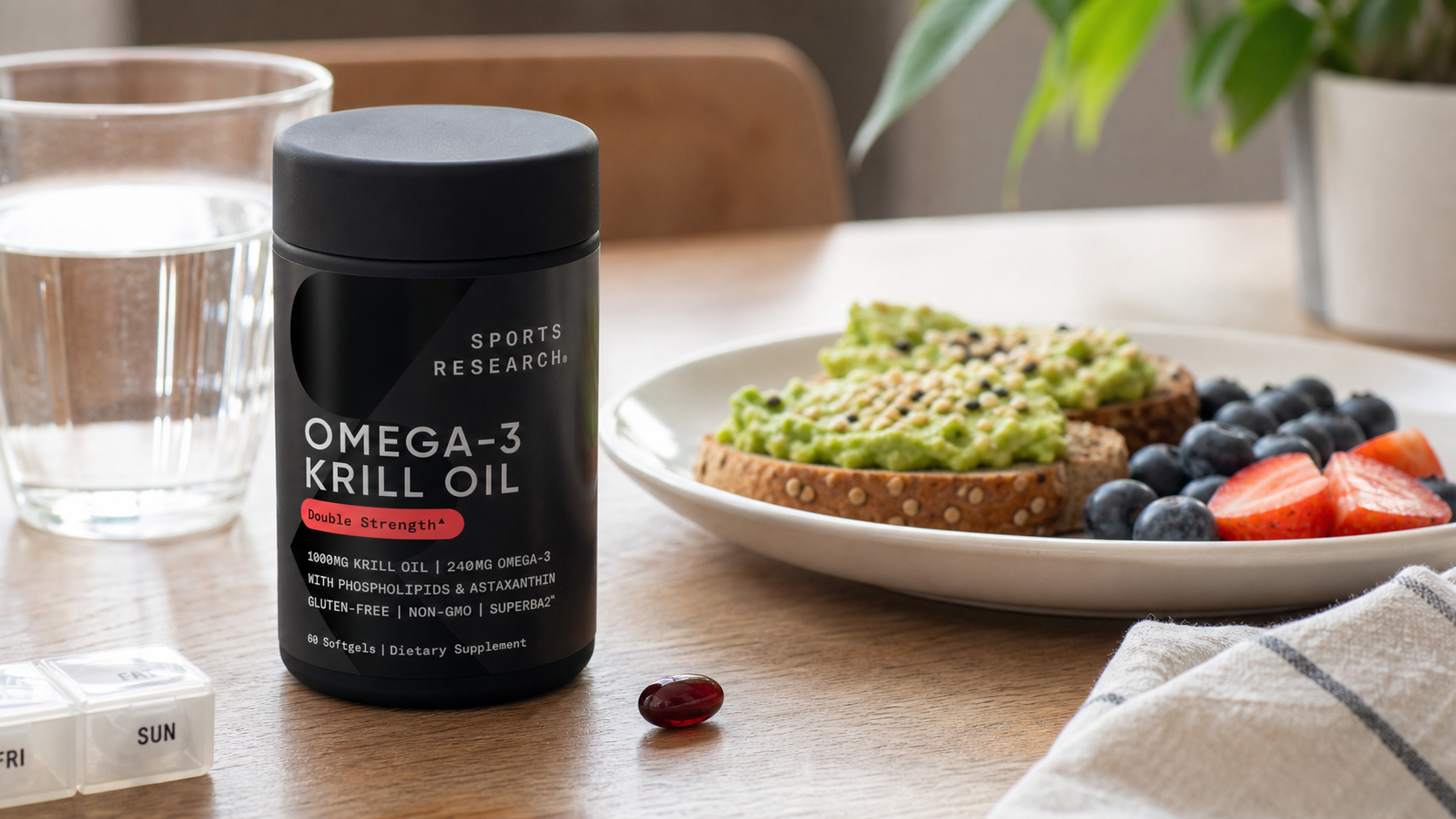 Sports Research krill oil bottle beside water, avocado toast, fruit, and one softgel