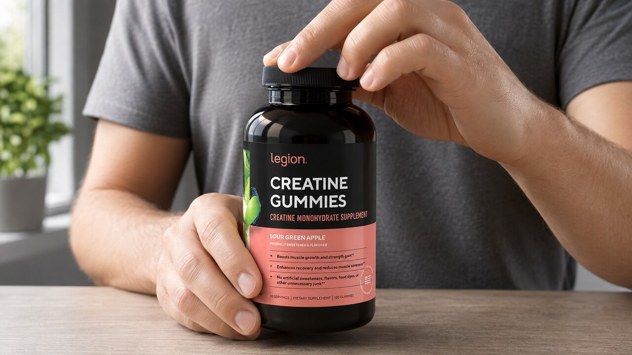 Legion Green Apple creatine gummies bottle being opened