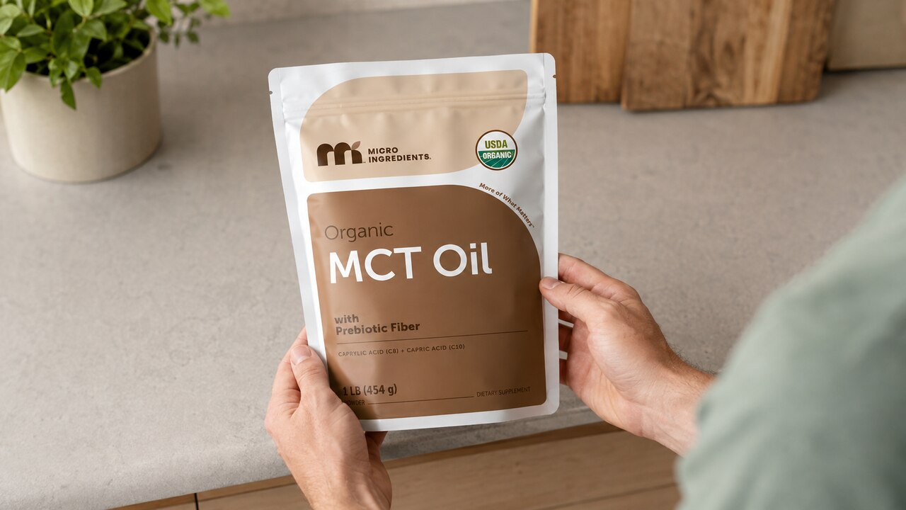 Micro Ingredients 1 lb MCT oil powder pouch held for label viewing