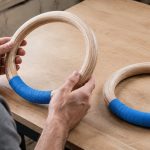 PACEARTH wooden rings with blue grip tape being inspected