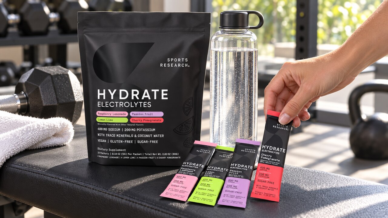 Sports Research Hydrate variety pouch and packets beside a water bottle