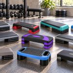 Ten selected aerobic step platforms and their matching risers arranged on a gym floor with brand details visible