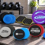Ten exercise slider models arranged on a gym bench, including round discs, covered pairs and yellow-rimmed shaped platforms