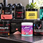Ten selected pre-workout packages arranged on a gym bench with their exact flavor labels facing forward