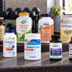Ten calcium citrate supplements arranged on a gym bench