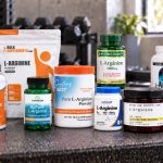 Ten l-arginine supplements arranged on a gym bench